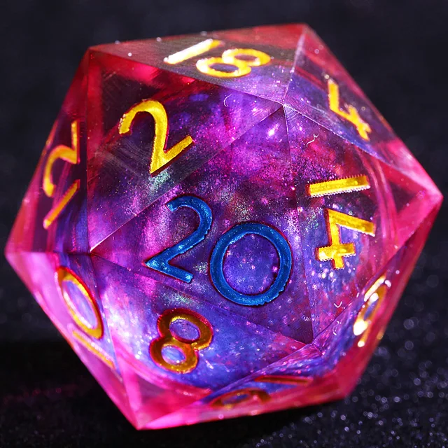 Close-up of a crimson-pink D20 with a shimmering violet-blue core and blue and gold numbers.
