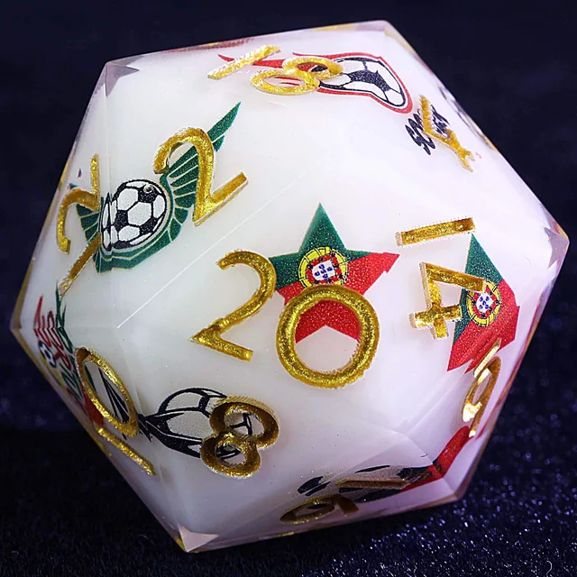Close-up of a white D20 with gold numbers, football graphics, and red-and-green Portugal motifs.