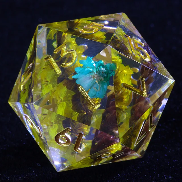 Clear D20 with yellow and turquoise flowers and gold numbers.