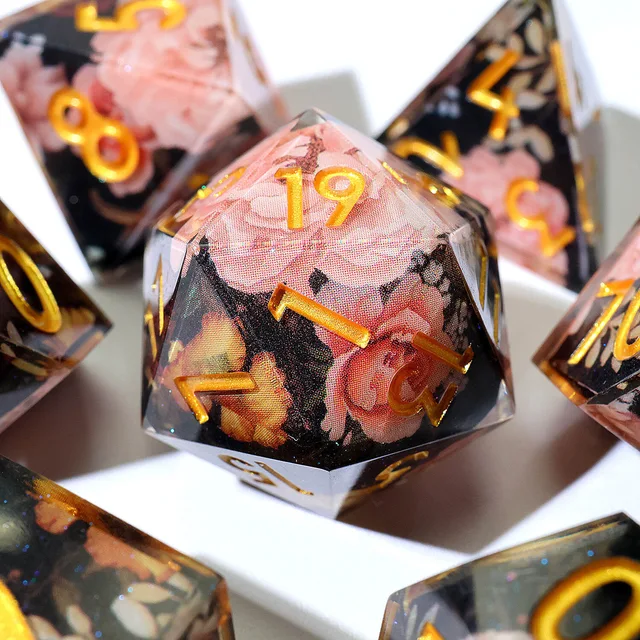 Close-up of the floral D20 with gold numbers.