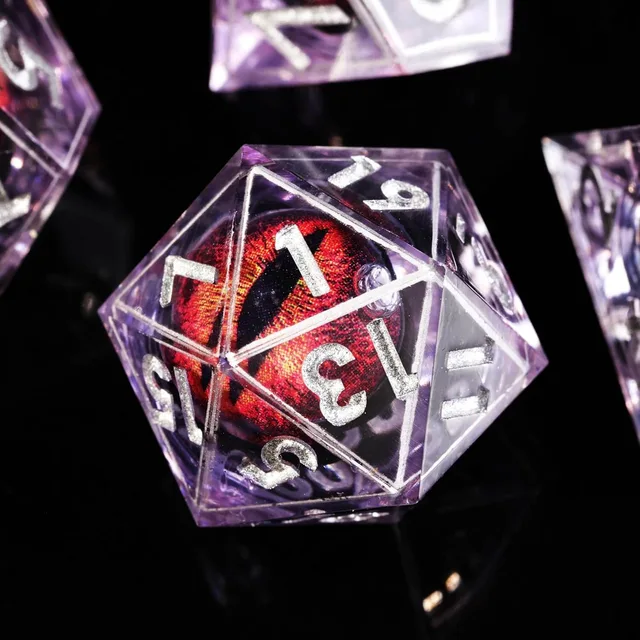Close-up of a purple D20 with silver numbers and a red slit-pupil eye.