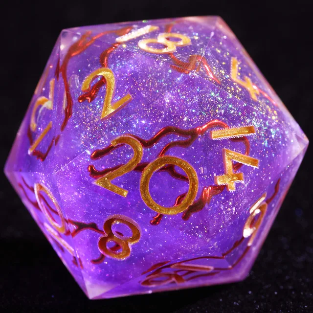 Close-up of a sparkly purple D20 with gold numbers and winding reddish metallic veins.