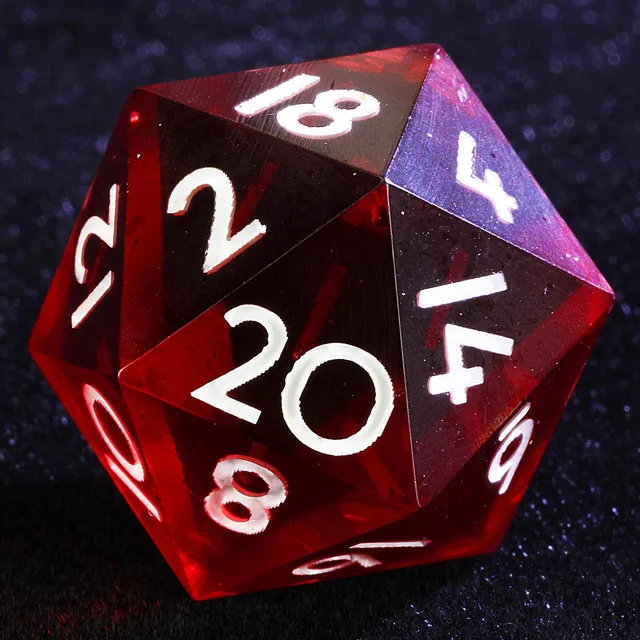 Close-up of a translucent red D20 with white numerals