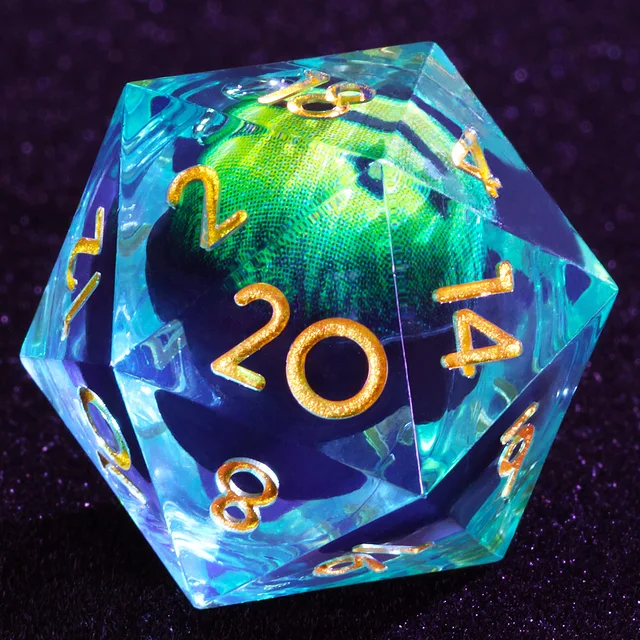 Close-up of a blue-tinted D20 with gold numbers and a green eye-like core.