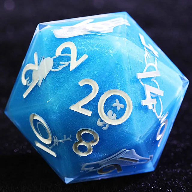 Close-up of a blue D20 with white numbers and pale sea-inspired details.