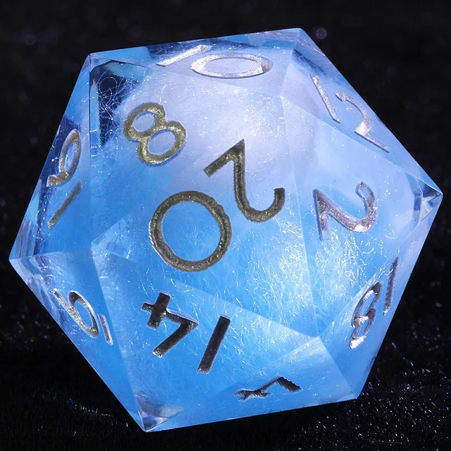 Close-up of a translucent blue D20 with a wispy pale interior and metallic numerals.