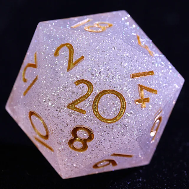 Close-up of a pale lavender-pink glitter D20 with gold numbers.
