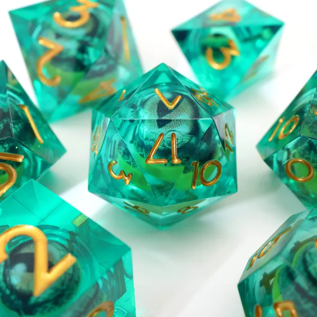 Green twenty-sided eye-core die with gold numerals on white