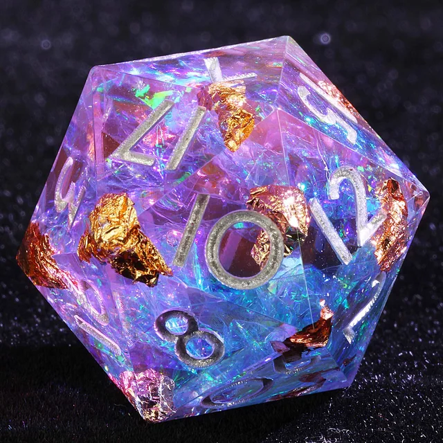 Close-up of a purple-blue iridescent D20 with copper-gold flecks and silver-coloured numbers.