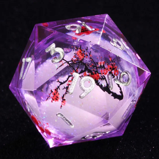 Purple liquid-core D20 with silver numbers and red blossoms on black branches.