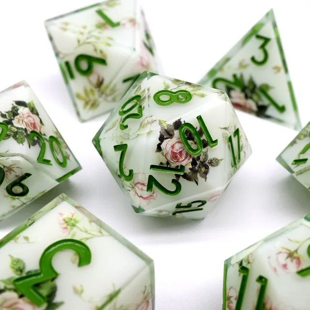Rose-patterned D20 with green numbers, surrounded by matching dice.