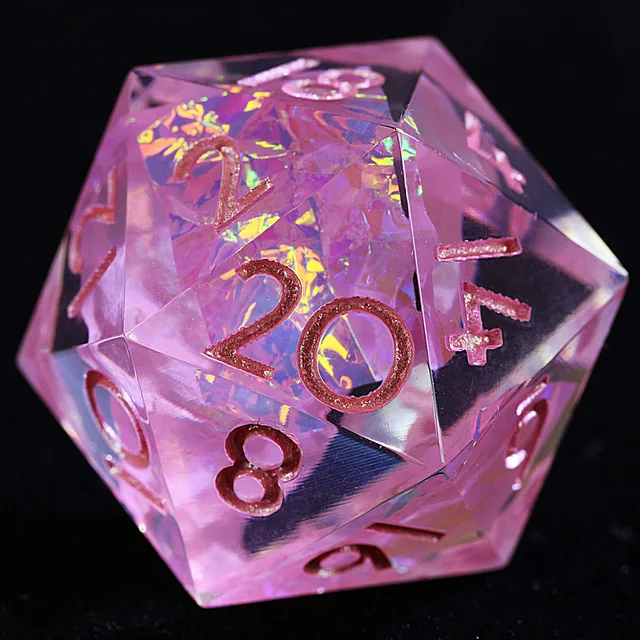 Close-up of a pink iridescent D20 with rose-gold-toned numbers.