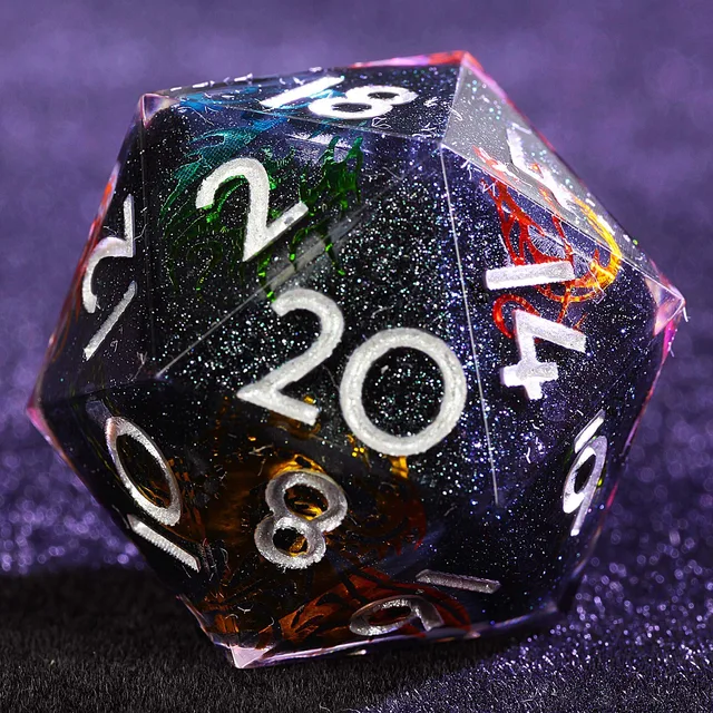 Close-up of a black glitter D20 with silver numbers and colourful dragon designs.