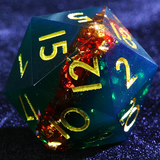 Close-up of a blue-green translucent D20 with red flecks and gold numbers.