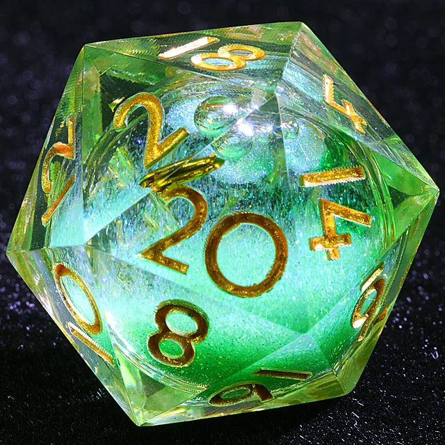 Close-up of a clear green-tinted D20 with a sparkling green core and gold numbers.