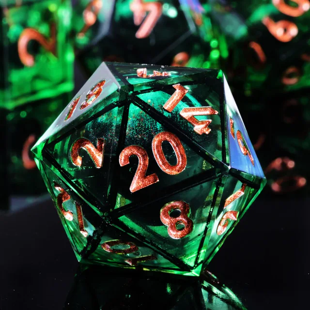 Close-up of a green D20 with an eye-like centre and copper-orange numbers.
