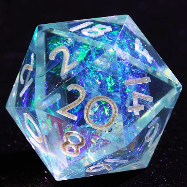 Close-up of a translucent blue D20 with iridescent inclusions and silver numerals.