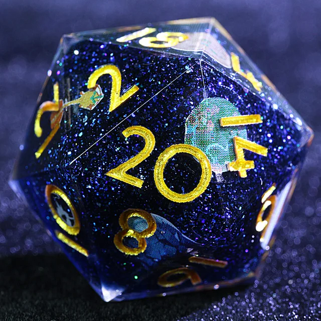 Close-up of a dark blue glitter D20 with gold numbers and planet graphics.