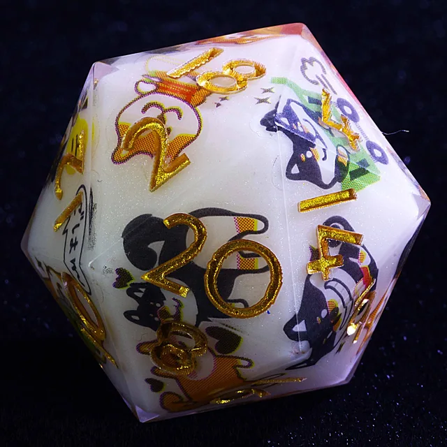 Close-up of a white D20 with gold numbers and colourful cartoon dog illustrations.