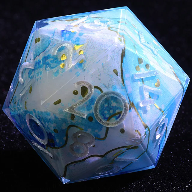 Close-up of a blue and white D20 with gold accents and silver numerals.