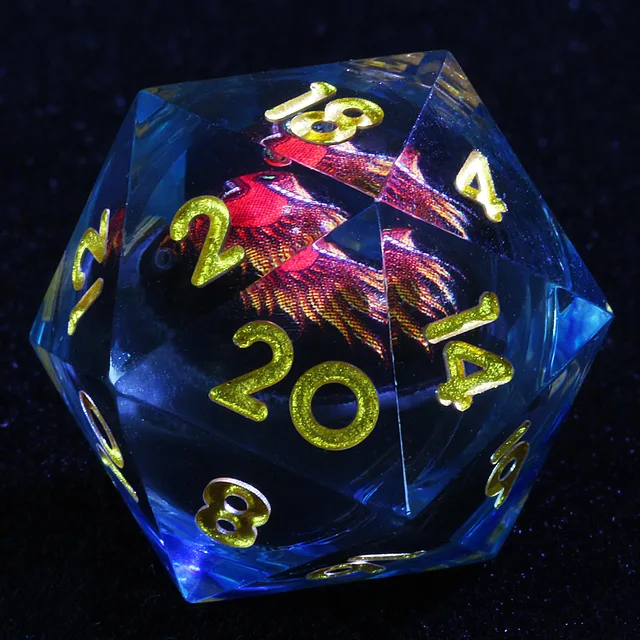 Close-up of a clear blue-tinted D20 with gold numbers and a red dragon design in its dark core.
