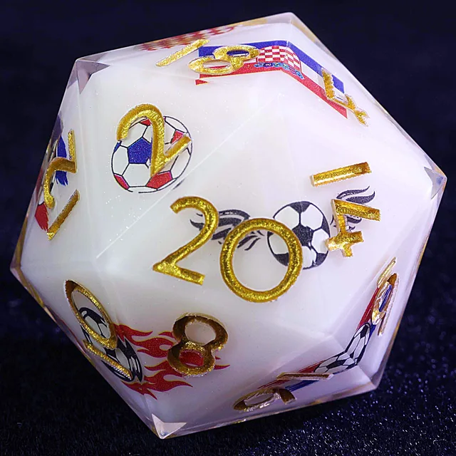 Close-up of a white D20 with gold numbers and football and Croatia-themed graphics.