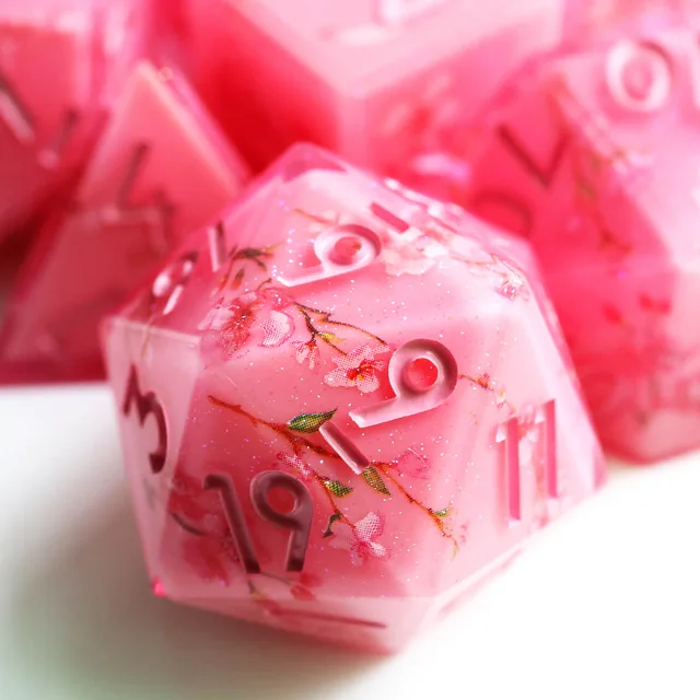 Pink floral D20 close-up with sharp edges.