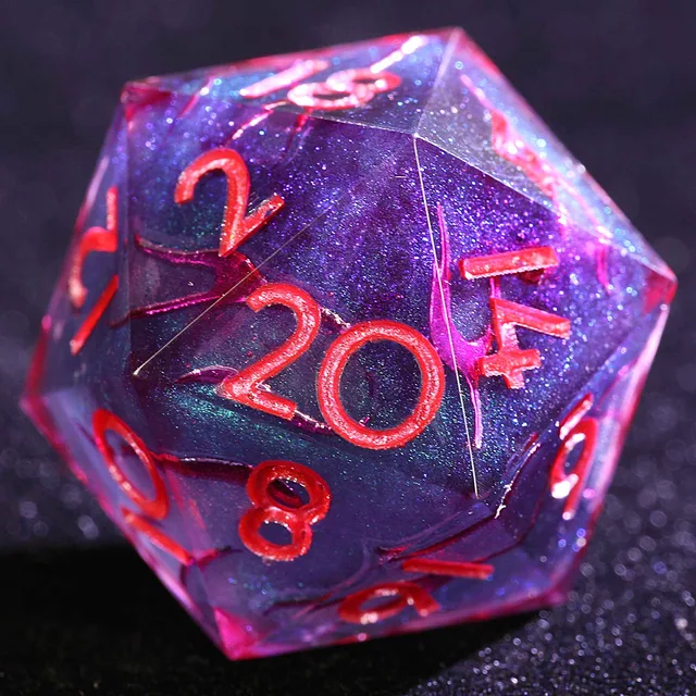Close-up of a glittering blue-purple D20 with red numerals and translucent pink-red edges.