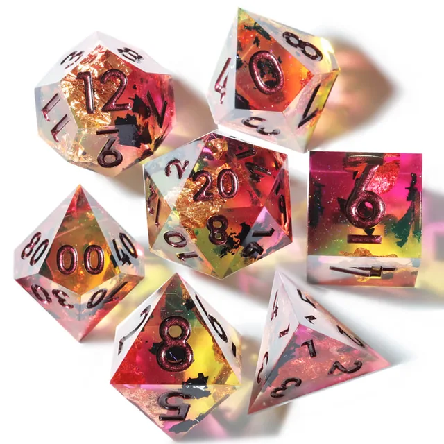 Seven multicoloured translucent dice with dark numerals on white.