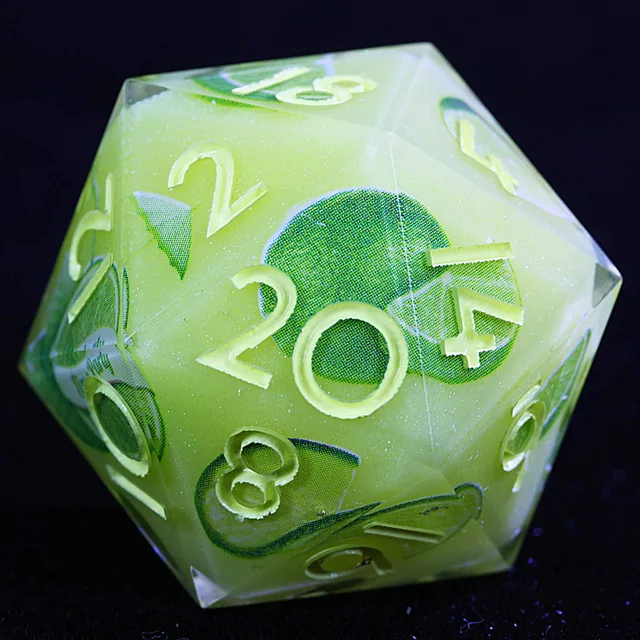 Close-up of a pale green D20 with green citrus designs and yellow numbers.