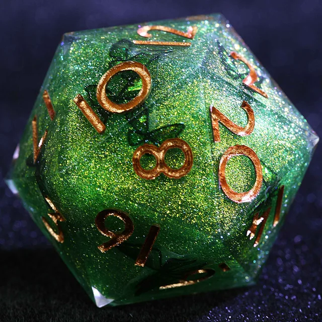 Close-up of a green glitter D20 with copper-gold numbers and dark inclusions.