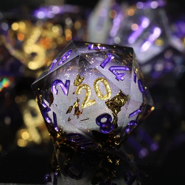 Close-up of a lavender-purple D20 with a pale shimmering core and gold-coloured 20.