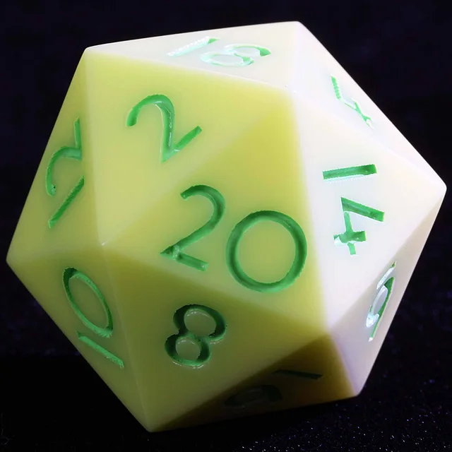 Close-up of a pale cream and yellow-green D20 with green numerals.