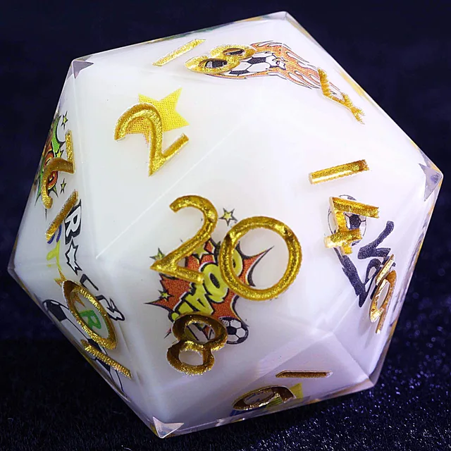 Close-up of a white D20 with glittery gold numbers and colourful football graphics.