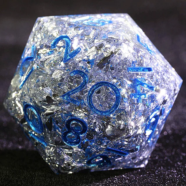 Close-up of a translucent grey D20 filled with silver foil and marked with blue numerals.