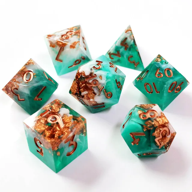 Seven teal and white dice with copper-gold flakes and copper numerals on white.