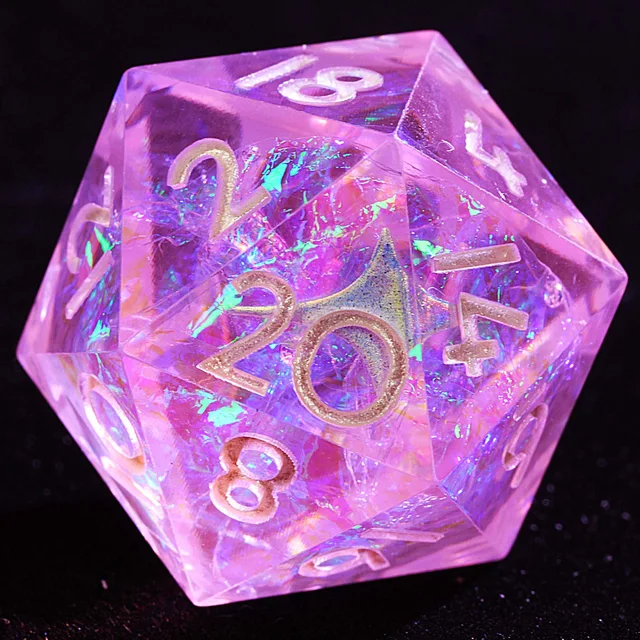 Close-up of a translucent pink D20 with iridescent flecks and pale metallic numerals.