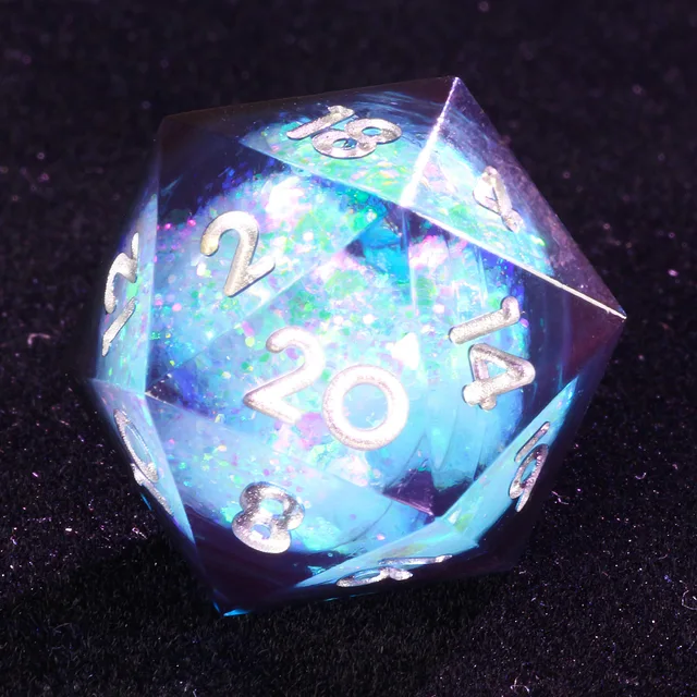 Close-up of a transparent D20 with a pale core and silver-coloured numbers.