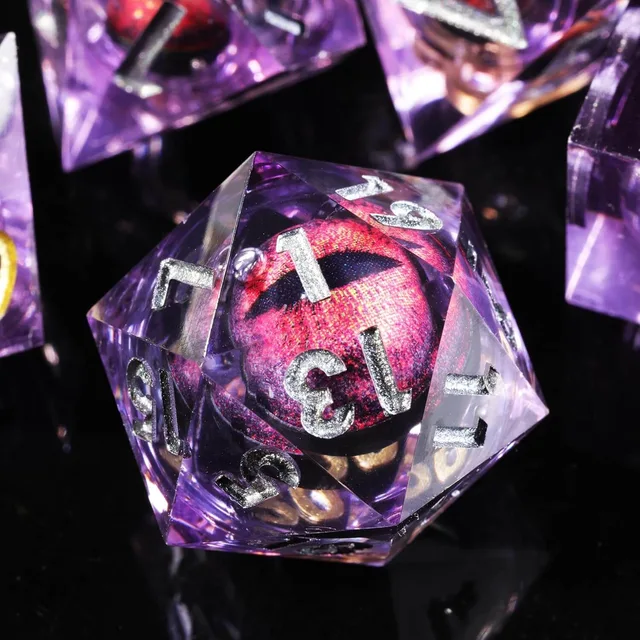 Close-up of a purple D20 with a red slit-pupil core.