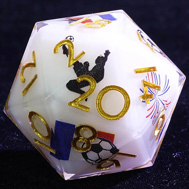 Close-up of a white D20 with gold numbers, a football, a player silhouette, and red and blue graphics.