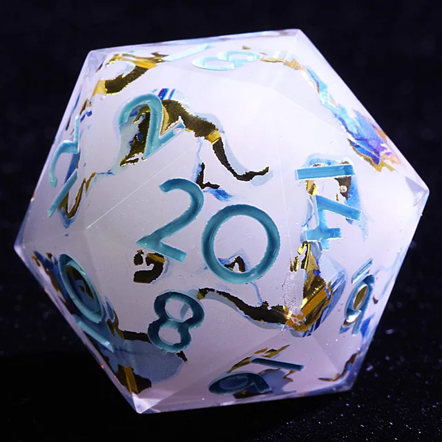 Close-up of a clear D20 with a cloudy pale interior, blue and gold ribbons, and aqua numerals.
