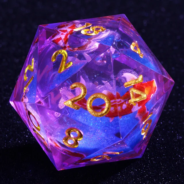 Close-up of a gold-numbered D20 with a blue centre and red-and-white fish shapes.
