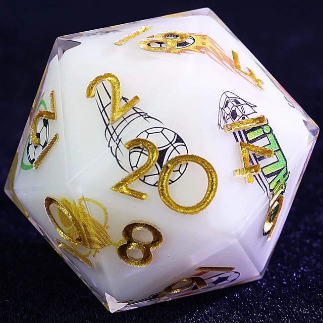 Close-up of a white D20 with gold numbers and football graphics.