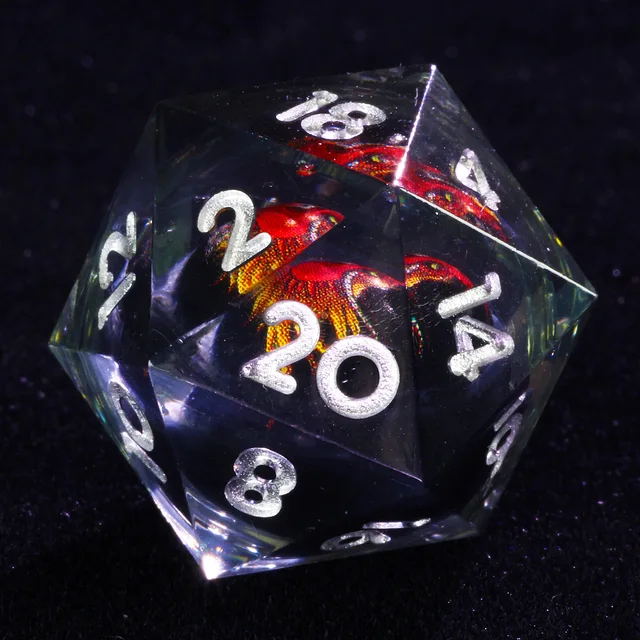 Close-up of a clear D20 with silver numbers and a red-orange dragon core.