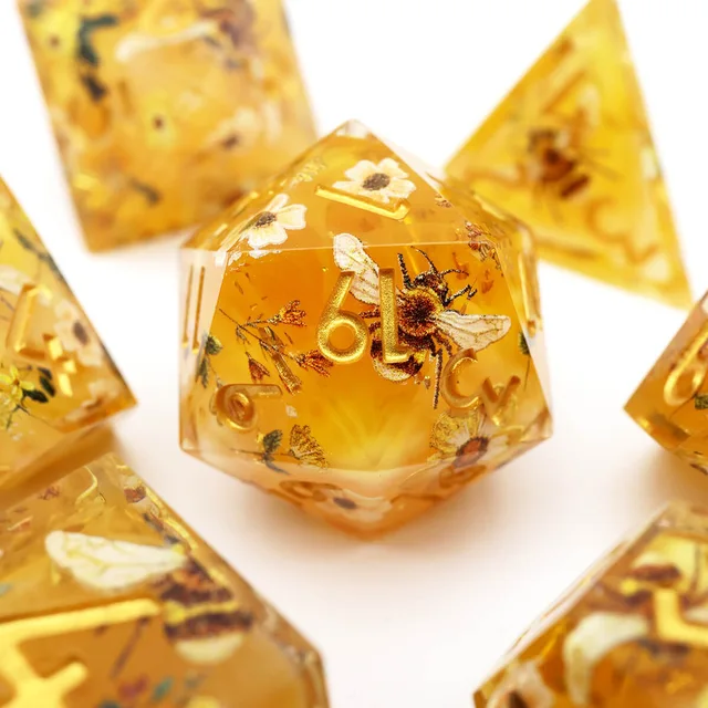 Amber D20 with a bee, small flowers, and gold numbers.