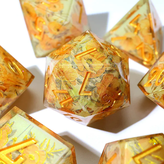 Close-up of a yellow floral D20 with gold numbers