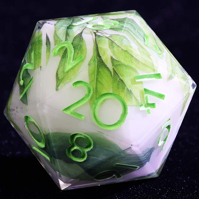 Close-up of a white and clear D20 with green leaves and bright green numbers.