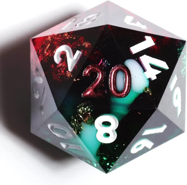 Close-up of a sharp-edged D20 with red and green glitter, pale blue-green swirls, and a metallic red 20.