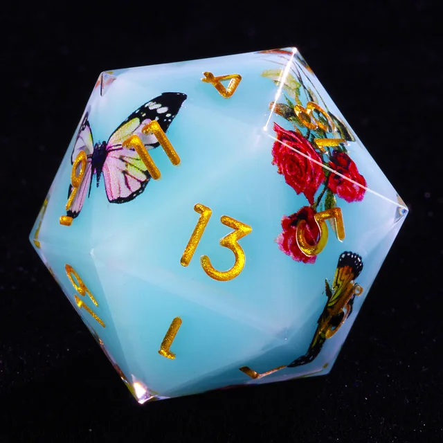 Pale blue D20 with gold numbers, a pink butterfly, and red roses.