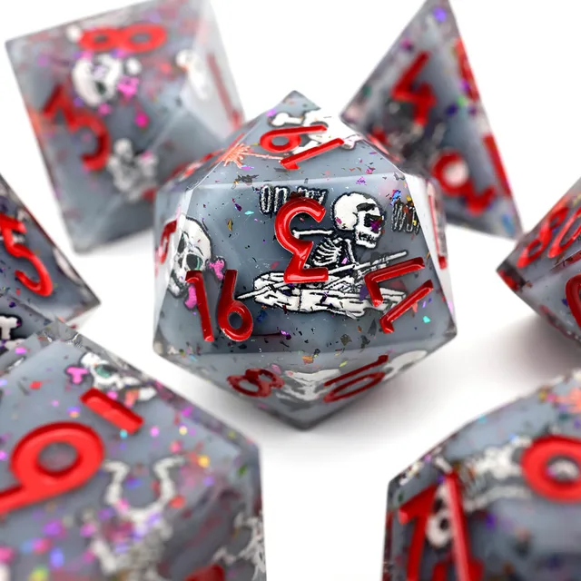 Close-up of a grey D20 with red numbers and a white skeleton design.